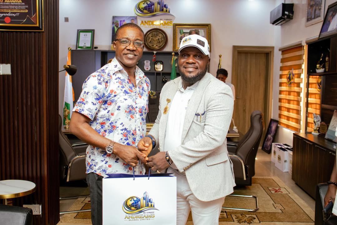 The Andreams chairman presenting a branded gift to a guest